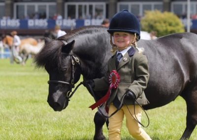 Anna Marshall, 4, with Harviestoun Rhuri, 21, in the Grand Parade at the Royal Highland Show after coming 6th in the gelding class.