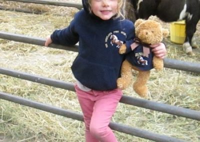 Lucie Dale with her Society hoodie and bear with same monogrammed top.